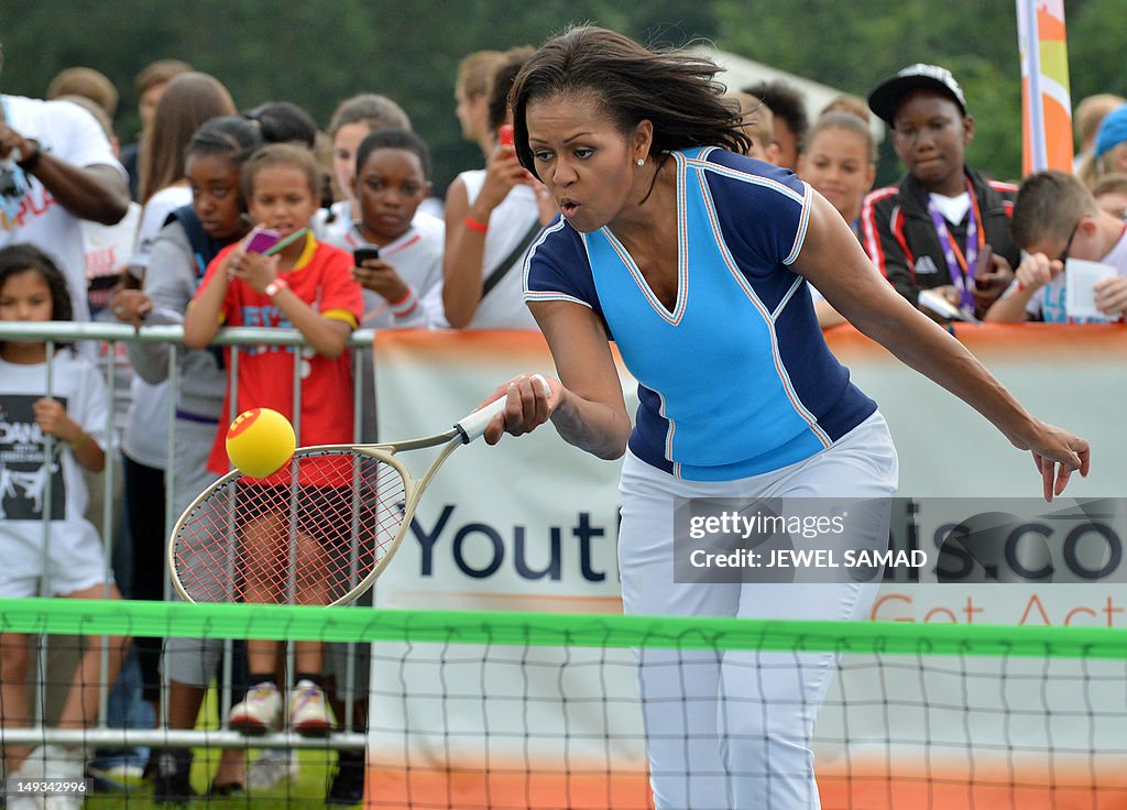 US First Lady Michelle Obama plays tenni