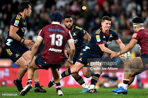 Freddie Burns of the Highlanders charges forward during the round 14 Super Rugby Pacific match between Highlanders and Queensland Reds at Forsyth...
