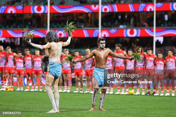 Indigenous performers dance during the round 11 AFL match between Sydney Swans and Carlton Blues at Sydney Cricket Ground, on May 26 in Sydney,...