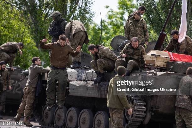Ukrainian military members get off from of infantry fighting vehicle after returned from captivity on May 25, 2023 in Donetsk Oblast, Ukraine. 106...