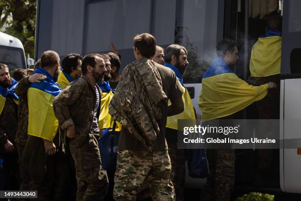 Ukrainian military members get on the bus after returned from captivity on May 25, 2023 in Donetsk Oblast, Ukraine. 106 soldiers who participated in...