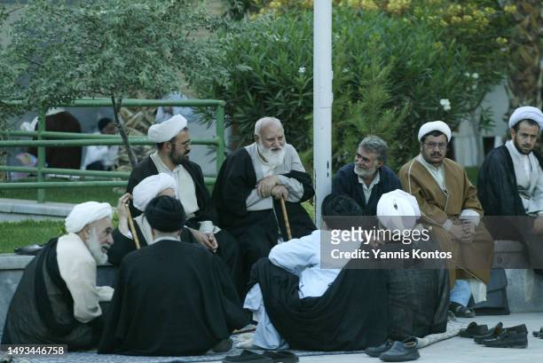 Iranian scholars engage in lively discussions and diligent studies at the scenic yard of Feyziyeh School, in Qom, May 28, 2005. Feyziyeh School is a...