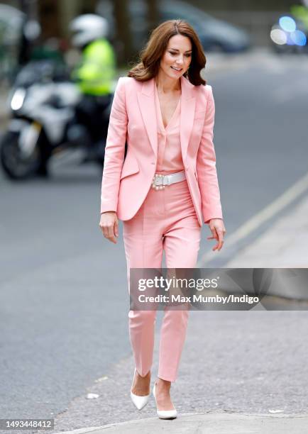 Catherine, Princess of Wales arrives, flanked by a Metropolitan Police motorcycle outrider of the Special Escort Group , for a visit to the Foundling...