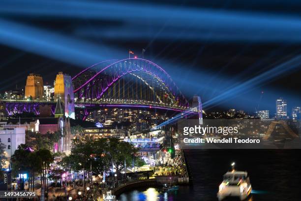 The Sydney Harbour Bridge is illuminated with projections and lights at the start of the Vivid Sydney festival on May 26, 2023 in Sydney, Australia....