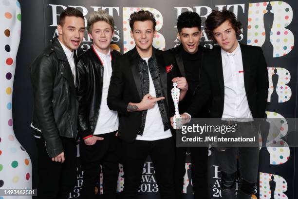 One Direction pose with award backstage during The BRIT Awards 2013 at The O2, on February 20, 2013 in London, England. L-R Liam Payne, Niall Horan,...