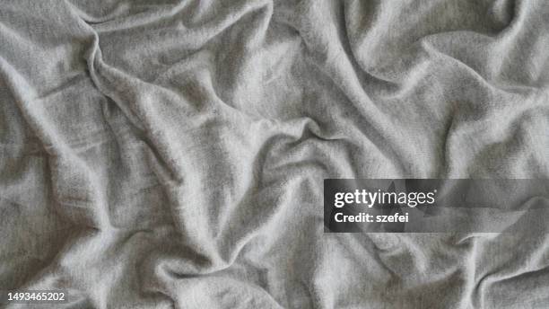 full frame shot of gray crumpled cotton sheet - blanket stock pictures, royalty-free photos & images