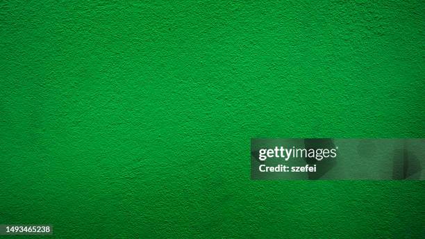 green concrete wall background - grainy wall stock pictures, royalty-free photos & images