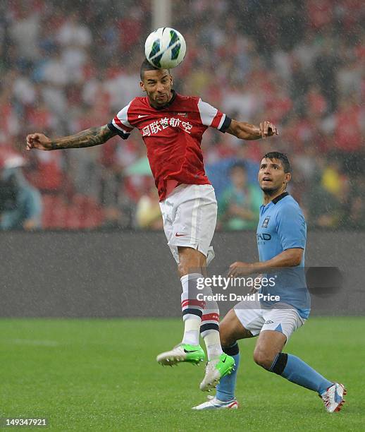 Craig Eastmond of Arsenal FC heads the ball away from Sergio Augero of Manchester City during the pre-season Asian Tour friendly match between...