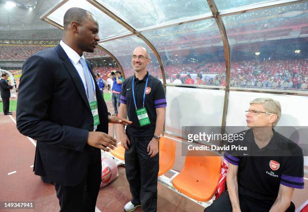 Former Arsenal player Patrick Vieira chats to Steve Morrow and Arsene Wenger, manager of Arsenal FC before the pre-season Asian Tour friendly match...