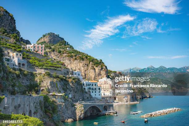 atrani, amalfi coast, campania, sorrento, italy. view of the town and the seaside in a summer sunset - sorrento stockfoto's en -beelden