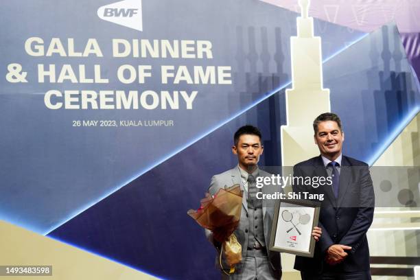 Lin Dan of China and BWF president Poul-Erik Hoyer Larsen of Denmark pose for photographs during the BWF Hall of Fame for 2023 at Kuala Lumpur...