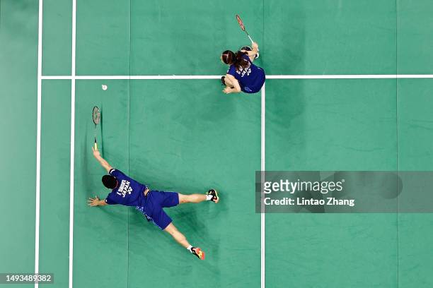 Kyohei Yamashita and Naru Shinoya of Japan compete in the Mixed Doubles Round Robin match against Marcus Ellis and Lauren Smith of England during day...