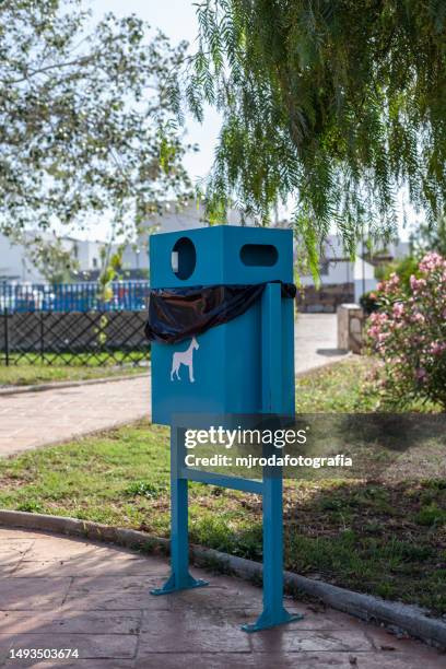 dog waste container in a public park - dog waste bin stock pictures, royalty-free photos & images