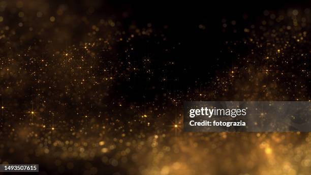 golden blurred particles. copy space - sparkle photos et images de collection