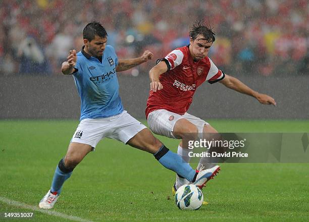 Ignasi Miquel of Arsenal FC in action with Sergio Augero of Man City during the pre-season Asian Tour friendly match between Arsenal and Manchester...