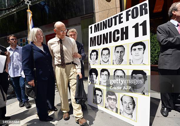 Avi Melamed , surviving member of the 1972 Israeli Olympic team, walks past a poster after he joined Jewish and New York community members in a...