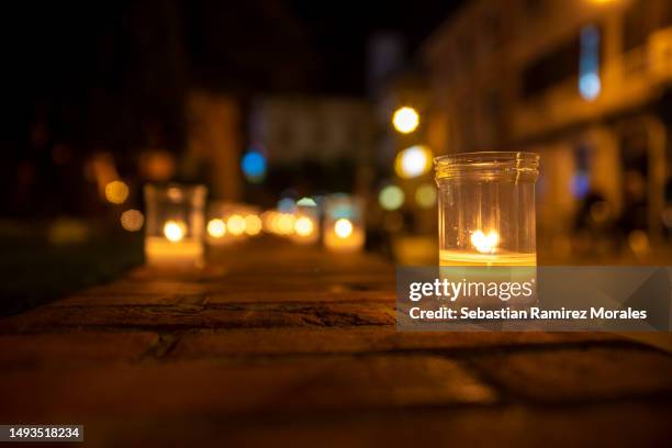 lighted candles in the street, religious tradition - memorial candle stock pictures, royalty-free photos & images