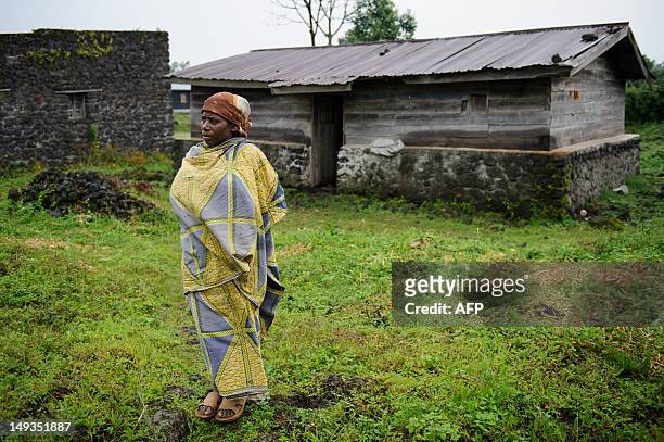 Congolese woman stands outside her home on July 27, 2012 in the nearly deserted town of Rugari, about 40km from the provincial capital Goma, in the...