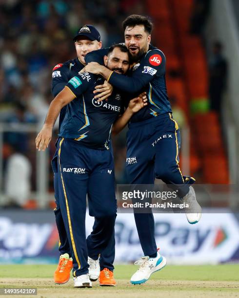 Mohammad Shami of Gujarat Titans celebrates with teammates after taking the wicket of Rohit Sharma of Mumbai Indians during the IPL Qualifier match...
