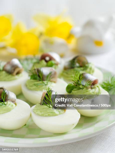 deviled eggs with anchovy for easter,selective focus - quality daffodils stock pictures, royalty-free photos & images