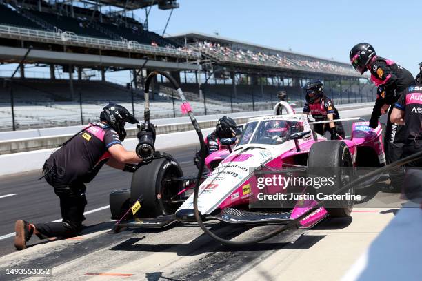 Helio Castroneves, driver of the AutoNation/Sirius XM Honda, makes a pit stop during practice at Carb Day for the 107th Indianapolis 500 at...