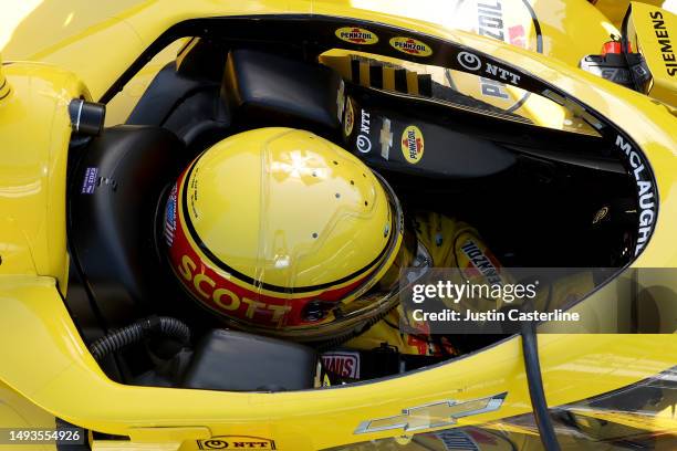 Scott McLaughlin, driver of the Pennzoil Team Penske Chevrolet, gets into his car before practice during Carb Day for the 107th Indianapolis 500 at...