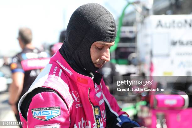 Helio Castroneves, driver of the AutoNation/Sirius XM Honda, prepares for practice during Carb Day for the 107th Indianapolis 500 at Indianapolis...