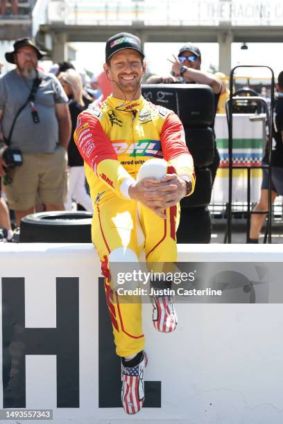 Roman Grosjean, driver of the DHL Honda, waits for practice during Carb Day for the 107th Indianapolis 500 at Indianapolis Motor Speedway on May 26,...