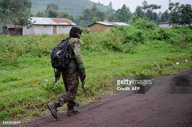 Congolese army soldier walks through the outskirts of the town of Rugari, some 37km from the provincial capital Goma, in the east of the Democratic...