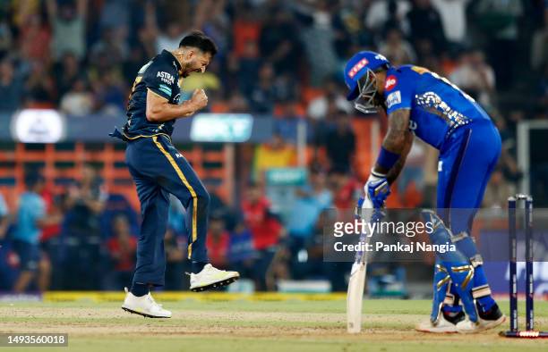 Mohit Sharma of Gujarat Titans celebrates after taking the wicket of Surya Kumar Yadav of Mumbai Indians during the IPL Qualifier match between...