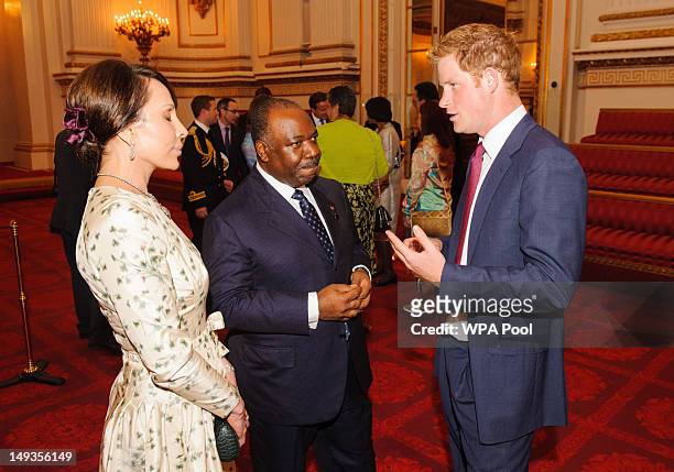 Prince Harry meets with the President of Gabon Ali Bongo Ondimba and his wife Sylvia during a reception at Buckingham Palace a reception for Heads of...