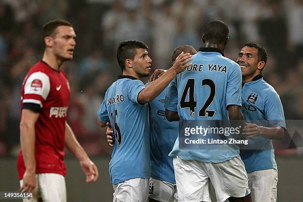 Yaya Toure of Manchester City celebrates with team-mates after scoring during the pre-season Asian Tour friendly match between Arsenal and Manchester...
