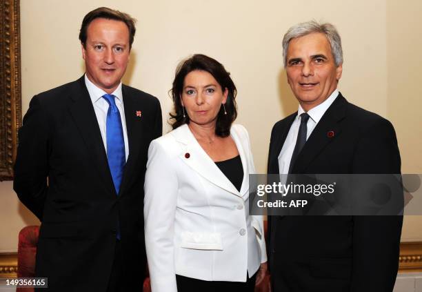 Prime Minister David Cameron poses with Austrian Chancellor Werner Faymann and his wife Martina during a reception at Buckingham Palace to welcome...