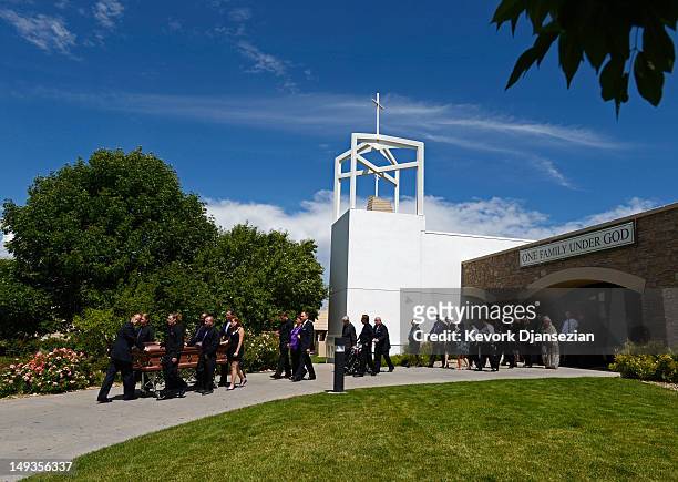 The casket of shooting victim Alexander Jonathan "A.J." Boik who recently graduated from Gateway High School, is wheeled by his classmates from the...