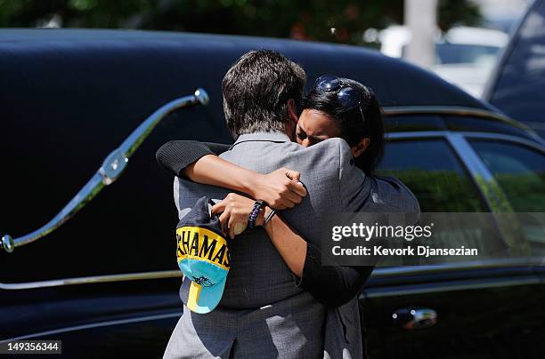 Lasamoa Cross , girlfriend of shooting victim Alexander Jonathan "A.J." Boik is comforted by Boik's uncle David Hoover after the funeral at Queen of...