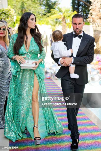 Philipp Plein and Morgan Osman walk the runway during the Philipp Plein Resort 2023 show during the 76th annual Cannes film festival at la Jungle du...