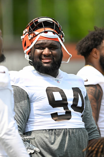 Dalvin Tomlinson of the Cleveland Browns looks on during the Cleveland Browns OTAs at CrossCountry Mortgage Campus on May 24, 2023 in Berea, Ohio.