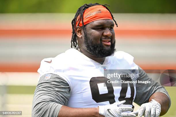 Dalvin Tomlinson of the Cleveland Browns walks off the field during the Cleveland Browns OTAs at CrossCountry Mortgage Campus on May 24, 2023 in...