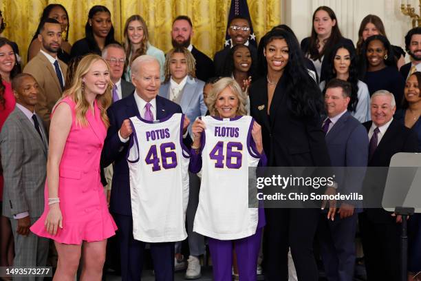 President Joe Biden and first lady Jill Biden pose for photographs with co-captains Emily Ward and Angel Reese during a celebration for the Louisiana...