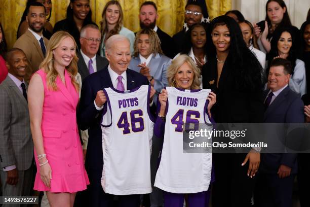 President Joe Biden and first lady Jill Biden pose for photographs with co-captains Emily Ward and Angel Reese during a celebration for the Louisiana...