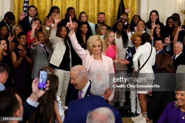 Louisiana State University women's basketball head coach Kim Mulkey flashes an L with her hand as the LSU fight song is played during a celebration...
