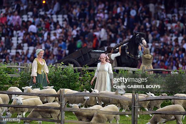 Artists perform in a pastoral scene with sheep on July 27, 2012 prior to the start of the opening ceremony of the London 2012 Olympic Games at the...