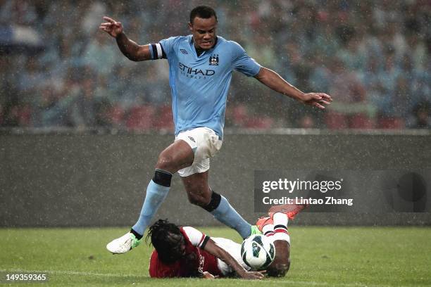 Gervinho of Arsenal challenges Vincent Kompany of Manchester City during the pre-season Asian Tour friendly match between Arsenal and Manchester City...