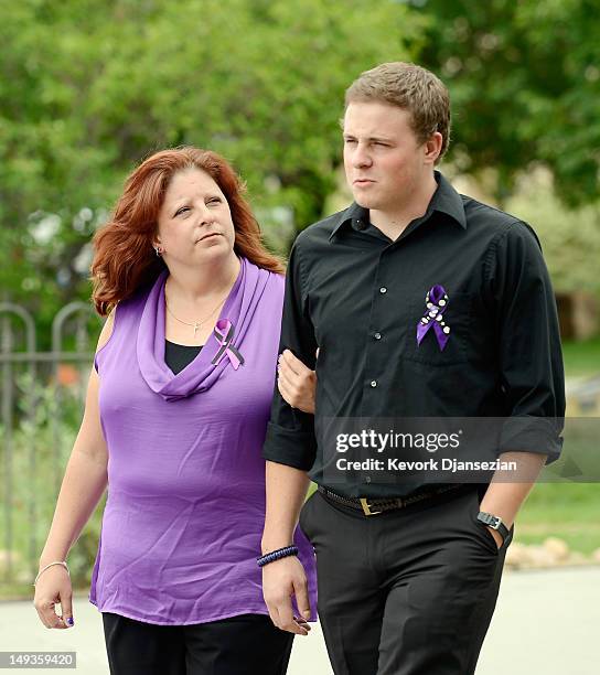 Mother Theresa Hoover is accompanied by her son Wil Boik after the funeral of her son Alexander Jonathan "A.J." Boik at Queen of Peace Catholic...