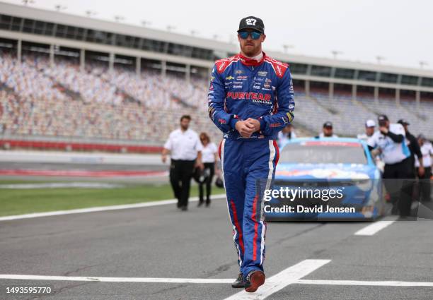 Jeb Burton, driver of the Puryear Tank Lines Chevrolet, walks the grid during qualifying for the NASCAR Xfinity Series Alsco Uniforms 300 at...