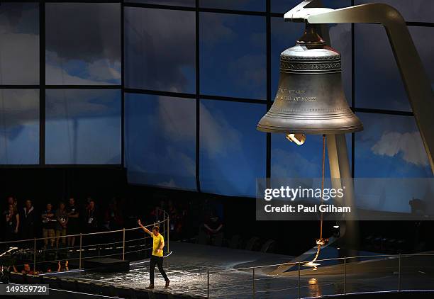 Bradley Wiggens of Great Britain and Tour de France winner 2012 rings the bell during the Opening Ceremony of the London 2012 Olympic Games at the...