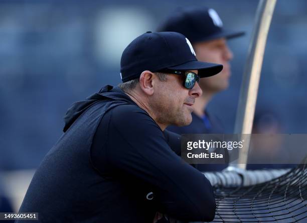 Manager Aaron Boone of the New York Yankees watches batting practice before the game against the San Diego Padres at Yankee Stadium on May 26, 2023...