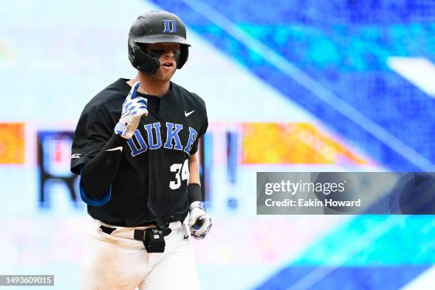 Luke Storm of the Duke Blue Devils celebrates his home run against the Miami Hurricanes in the eighth inning during the ACC Baseball Championship at...