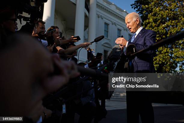 President Joe Biden talks to reporters as he departs the White House for the Memorial Day holiday weekend on May 26, 2023 in Washington, DC. "It's...