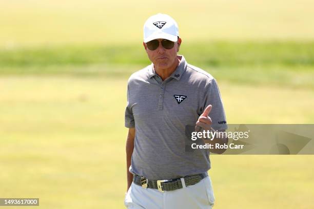 Phil Mickelson of HyFlyers GC gives the thumbs up while walking to the ninth green during day one of the LIV Golf Invitational - DC at Trump National...